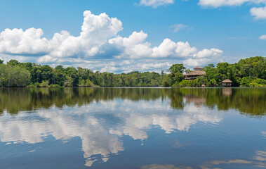 Fototapeta premium Amazon rainforest lodge reflection, Yasuni national park, Ecuador.