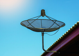 Satellite dish installed on the roof of the house for receiving television waves. Soft and...