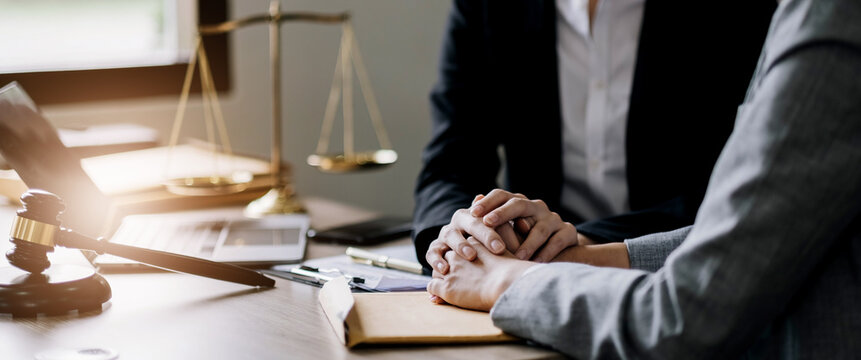Justice and attorney concept. Lawyer meeting and consoling solution to his client provide legal advice and trust commitment strain serious for problem