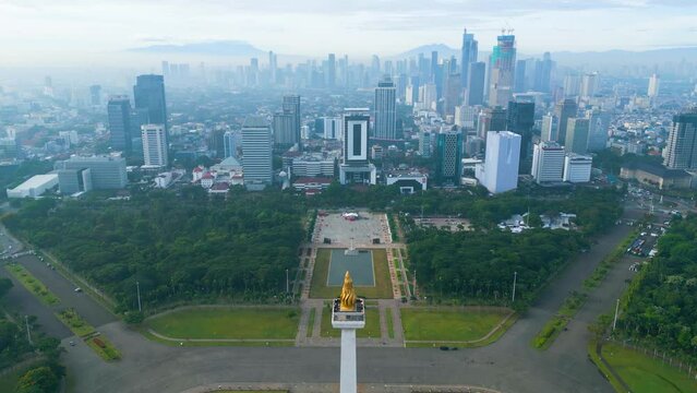 Misty Jakarta cityscape with National monument