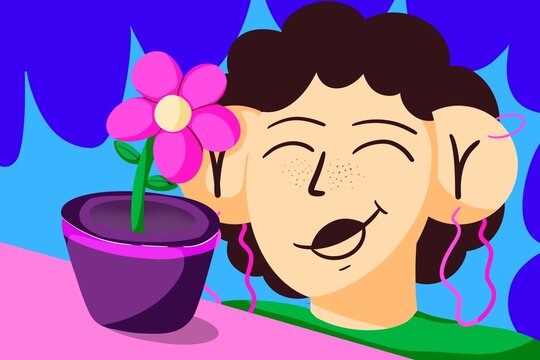 Smiling young woman with curly hair contemplates a flower in a pot