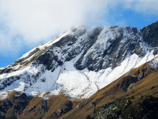 The first autumn snow on the Alpine peak Älplichopf (2641 m) in the Swiss Alps and in the UNESCO World Heritage Tectonic Arena Sardona (UNESCO-Welterbe Tektonikarena Sardona), Vättis - Switzerland