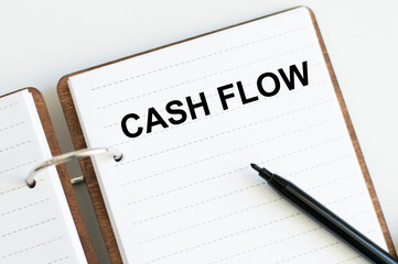 Cash flow p text on notepad. Business and cash flow concept