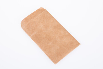 Kraft small brown paper square envelope isolated on white background