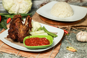 fried duck lalapan with vegetables and chili sauce