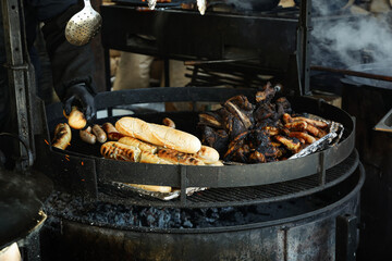 Grill outdoor with meat and bread in winter season