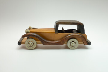 handmade wooden toy car on a white background