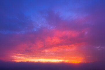 Naklejka na ściany i meble Beautiful sky dramatic sky with red clouds during twilight.