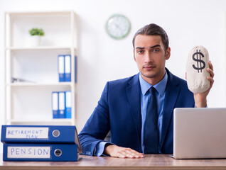 Young male accountant working in the office