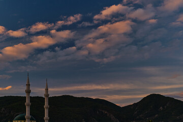 Obraz premium Early morning. Sunrise illuminates the minarets, the beginning of winter and the rainy season on the mediterranean coast
