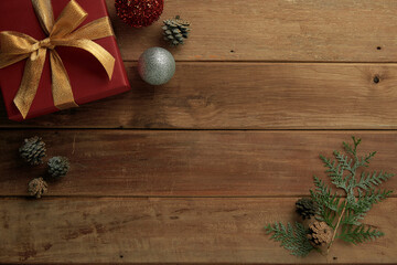 pine cones and gifts on vintage wooden background, winter mood