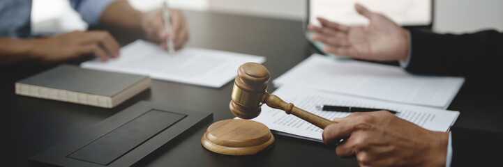 Lawyer discuss the contract and legal document agreement in office. Law and legal concept.