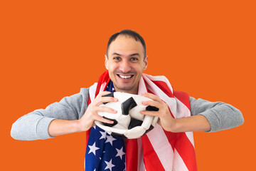 football fan with a deformed crumpled ball and an American flag