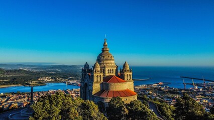 Scenic view of the Viana do Castelo with overlooking city buildings and the blue ocean during sunset