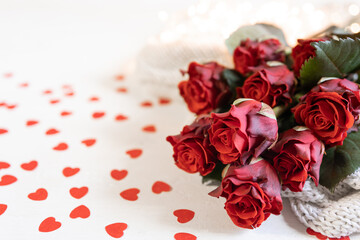 Festive background for Valentine's Day with a bouquet of red roses, copy space.