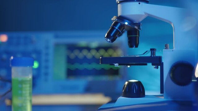Close up of a optical scientific microscope in laboratory. Science research technology and experiments. Concept of clinical lab and medical equipment.