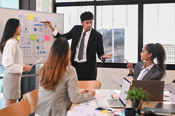 Shot of diverse businesspeople collaborating, brainstorming over new marketing during corporate meeting