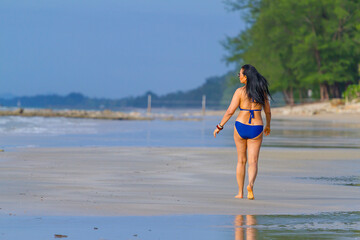 Woman body big walk enjoy with swimsuit in morning
