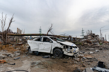 burnt cars and destroyed buildings of the workshop of the Azovstal plant in Mariupol