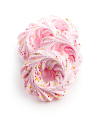 Pink sweet meringues with sprinkles isolated on white background.