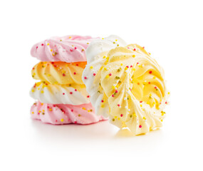 Different colors meringues with sprinkles isolated on white background.
