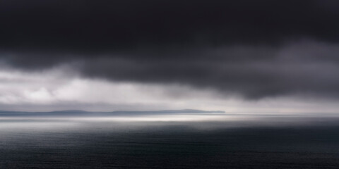 UK, Scotland, Panoramic view of dark dramatic clouds over Saint Magnus Bay