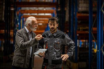 Warehouse manager and worker arguing about some errors done in work