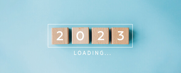 2023 New Year Loading. Loading bar with wooden blocks 2023 on blue background. Start new year 2023 with goal plan, goal concept, action plan, strategy, new year business vision. - obrazy, fototapety, plakaty