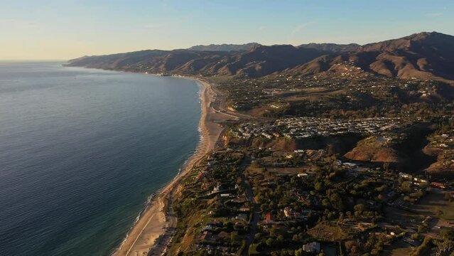 Aerial view of Zuma beach in Malibu, California. Crisp fall day with clear water near sunset.