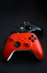 Two gamepads on a black background. The concept of the game, esports, leisure, gaming industry, video games. © Мария Охметзянова