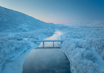 Aerial View Over Bridge in Finnish Lapland During Sunrise