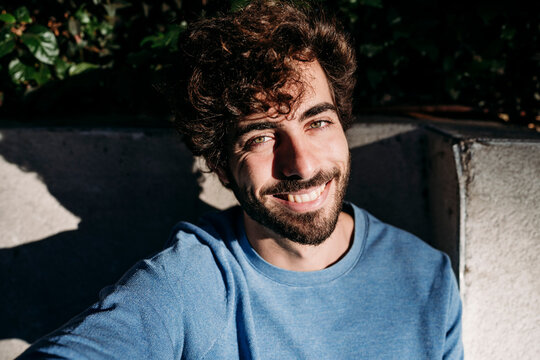 Happy man with sunlight on face