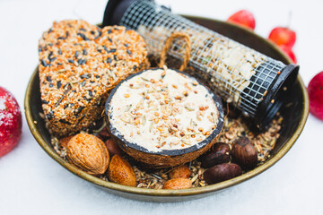 Winter birds feeding. Homemade food for birds.