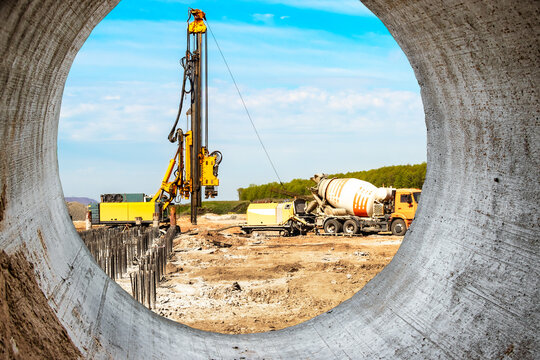 Hydraulic drilling machine at the construction site makes piles. Pile field. Modern drilling rig.