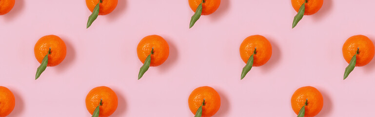 Banner with mandarin oranges pattern on pink background