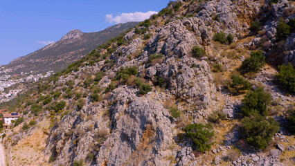 Fototapeta na wymiar Beautiful mountains in the south of the Mediterranean Sea. High rocks with wildlife against a blue sky background.