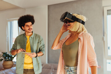 Couple design interior with virtual headset.