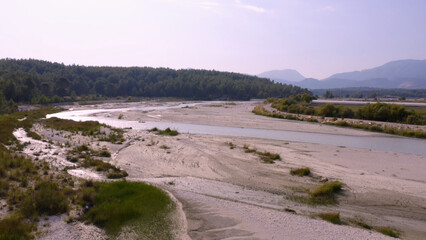Green forests, mountains and river. Beautiful nature landscape. Summer scenery.