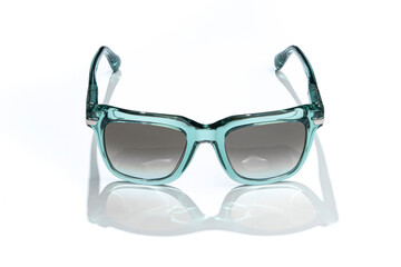 Women sunglass in sunlight on white background. Modern stylish sunglasses for holiday vacation....