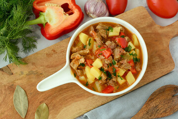 Bograch - Hungarian soup goulash with beef meat, potatoes, peppers and tomatoes