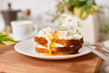 Breakfast on white bed sheets, good morning, toast with poached eggs, coffee, flowers, Hotel room early morning, honeymoon