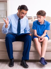 Internet addicted boy visiting male doctor