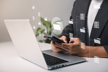 Businessmen use laptops to searching, managing and access information  in files online document database, for efficient archiving and company data. Document Management System (DMS) concept.