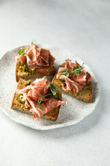 Toasts with ham and pesto