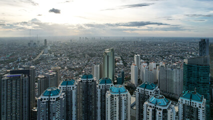 Aerial view of "Taman Anggrek" the biggest shopping mall and apartment in Jakarta when sunrise. 