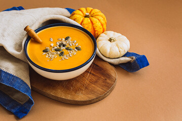 Pumpkin soup in a blue bowl