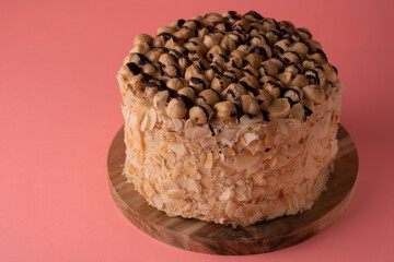 photo round walnut cake on a wooden board