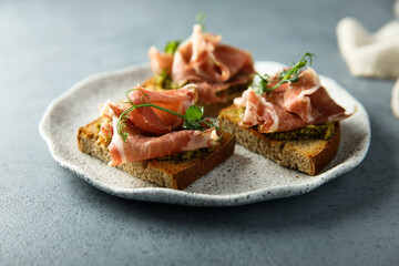 Toasts with ham and pesto