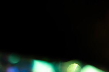 Blur colorful rainbow crystal light leaks on black background. Defocused abstract multicolored retro film lens flare bokeh analog photo overlay or screen filter effect. Glow Vintage prism colors