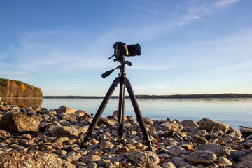 View of the camera on tripod on the rocky beach